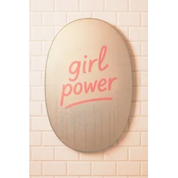 Oval bathroom mirror with ‘girl power’ written on a wiped, steamy surface