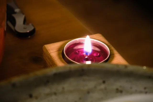 Lavender soy candle burning on a table