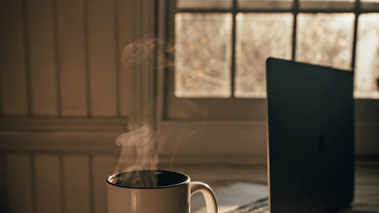 The Five Minute Journal on a cozy morning desk with coffee and soft light.