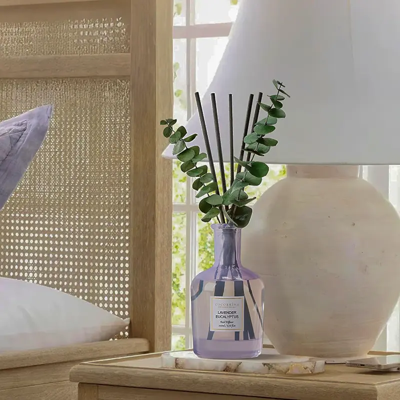 Lavender eucalyptus reed diffuser on a bedside table in soft natural light, creating a calm sensory evening atmosphere