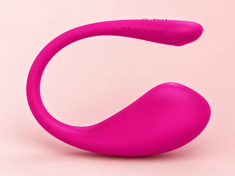 Magenta Lovense Lush 3 app-controlled wearable vibrator on a soft pink background for intimate wellness content